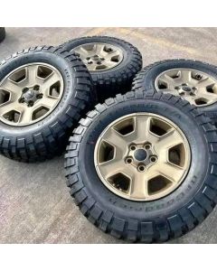 17 jeep Wrangler Rubicon OEM 
Bronze wheels and tires

Asking $ 900